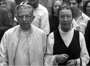 File---Sartre and Beauvoir released after arrest--Writer and philosopher Jean-Paul Sartre, left, and Simone de Beauvoir leave police station June 26 released after being picked up by police on a Paris street corner for distribution of a left wing newspaper. (AP Photo/str/MICOL)