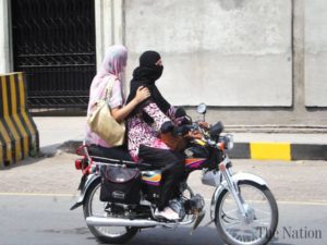 faisalabad-girl-students-riding-a-bike-as-transportation-has-become-a-major-issue-due-to-rising-6043